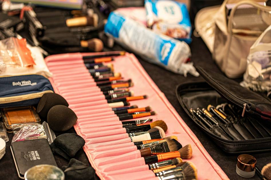 Organized makeup drawer with blush palettes and brushes