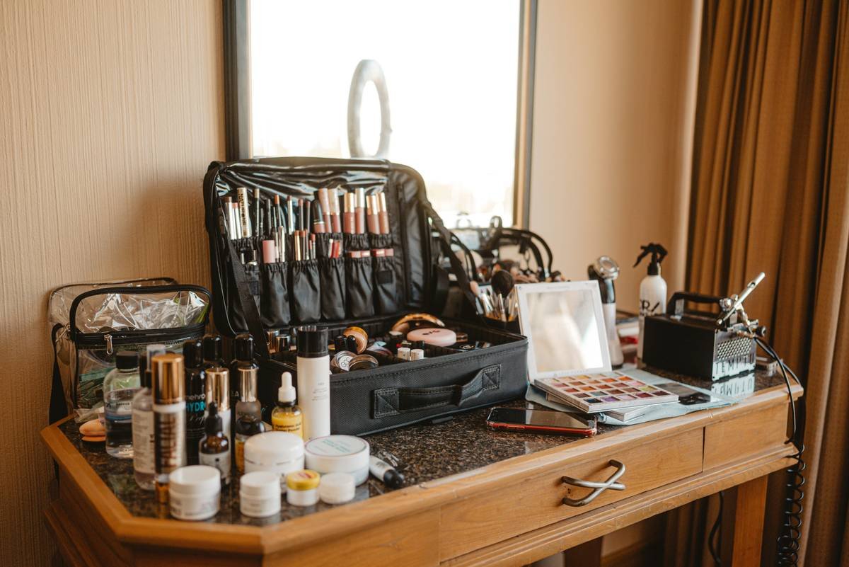 Before and after of organized makeup drawer set with labeled sections